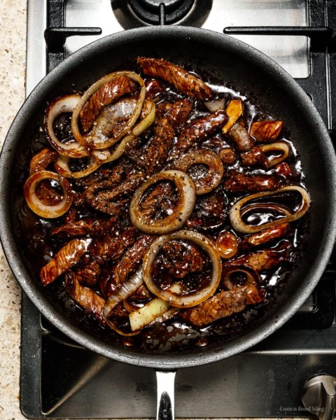 This super easy 7 ingredient ginger beef and onion stir fry is the answer to what’s for dinner tonight #stirfry #beefstirfry #dinner #recipes #quickandeasy #gingerbeef #betterthantakeout